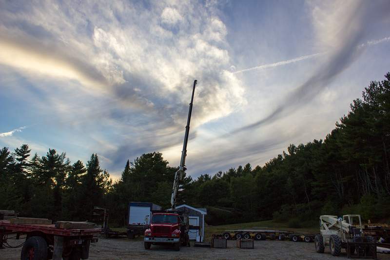 Smiley face clouds & boom truck